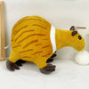 A yellow and brown tiger plush toy with white markings is shown against a white background.
