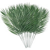 A vibrant green artificial tropical palm and monstera leaf arrangement.