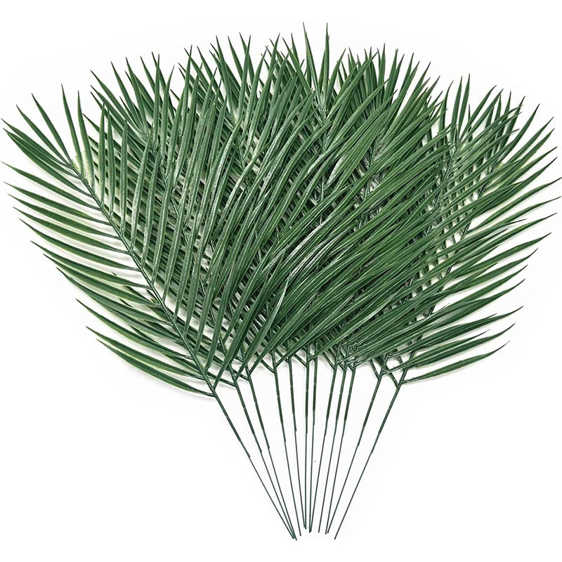 A vibrant green artificial tropical palm and monstera leaf arrangement.