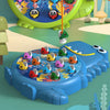 A blue magnetic fishing toy set with various colored plastic fish and a green fishing rod on a light green surface.
