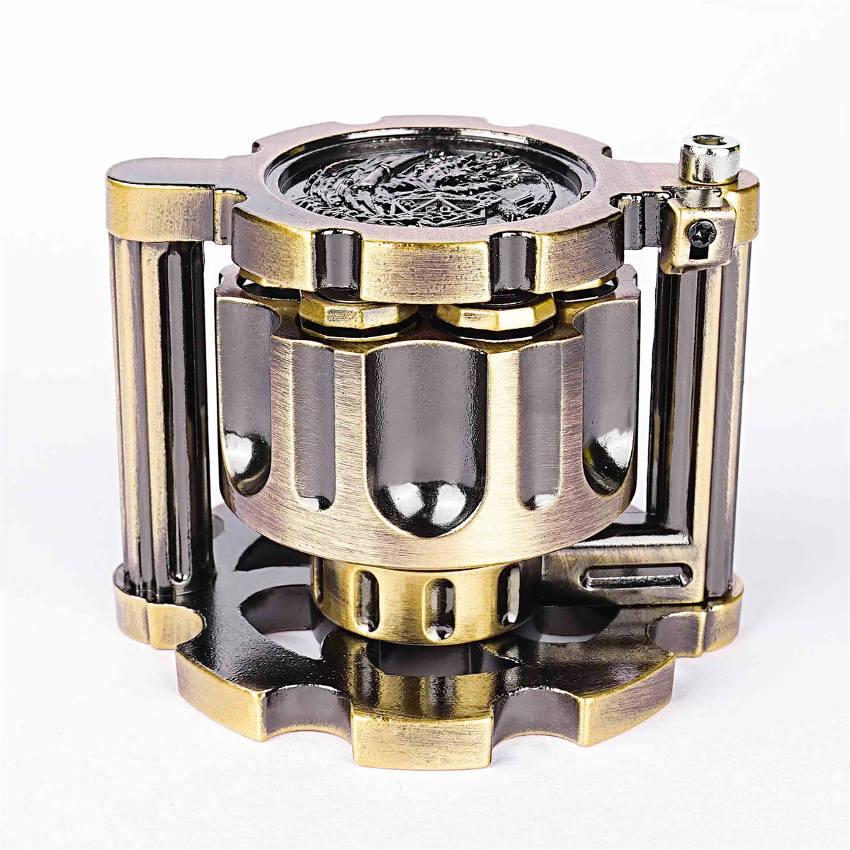 A set of revolver-shaped metal dice used for RPG games, featuring brass and dark metal components.