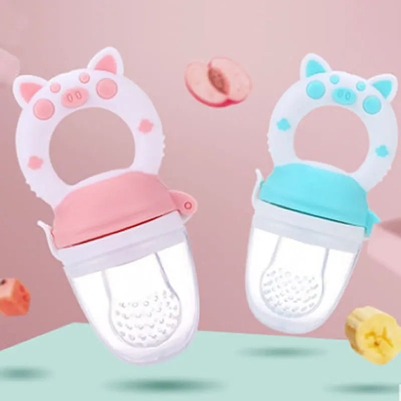 A white silicone baby food feeder with a pink top and a teal base, featuring a ring for teething.