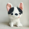 A white Chihuahua plush doll with black markings and a pink tongue sticking out.