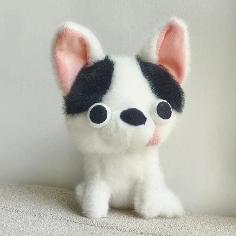 A white Chihuahua plush doll with black markings and a pink tongue sticking out.