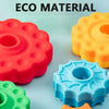 Colorful silicone spinning stacking tower with various colors like red, yellow, and blue for toddlers