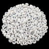 A pile of small white acrylic alphabet letter beads for jewelry making