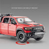 A red RAM TRX diecast pickup truck model is shown with the front wheels turned left and right.