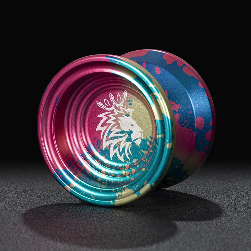 A close-up of a professional aluminum alloy yo-yo with high-speed ball bearings, featuring vibrant pink and blue colors.