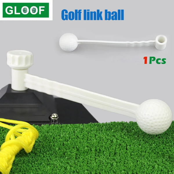 Ein weißer Golf-Link-Ball und Stock-Trainer liegen auf einer grünen Kunstrasenfläche.