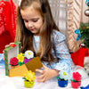 A young girl is interacting with a colorful sorting and stacking toy set featuring various flowers and plants.
