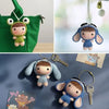 A set of handmade crochet dolls featuring various facial expressions and clothing options.