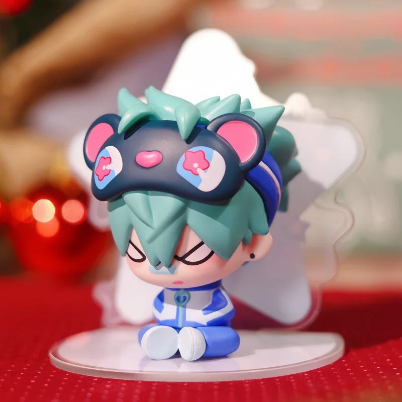A mini figure collectible of an anime character wearing a blindfold and headphones, featuring teal hair and blue clothing.