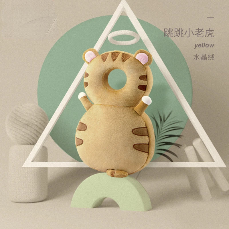 A yellow tiger-themed soft security pillow backpack for newborns displayed against a light green background.