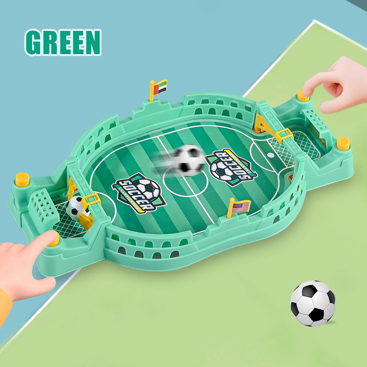 A green tabletop foosball game is shown with a soccer ball in motion, being played on a light green surface.