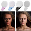 Portable LED selfie ring light in pink and blue colors shown next to a model using the full light feature