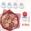 A set of four realistic pink and cream rose silicone molds for candle, soap, and crafting.
