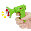 A hand holds a green voice changer toy with a red mouthpiece and a yellow sound effect indicator.