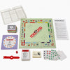 A set of Monopoly board game components including the board, cards, and tokens.