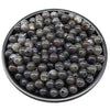 A pile of dark gray and brown acrylic round beads for jewelry making.