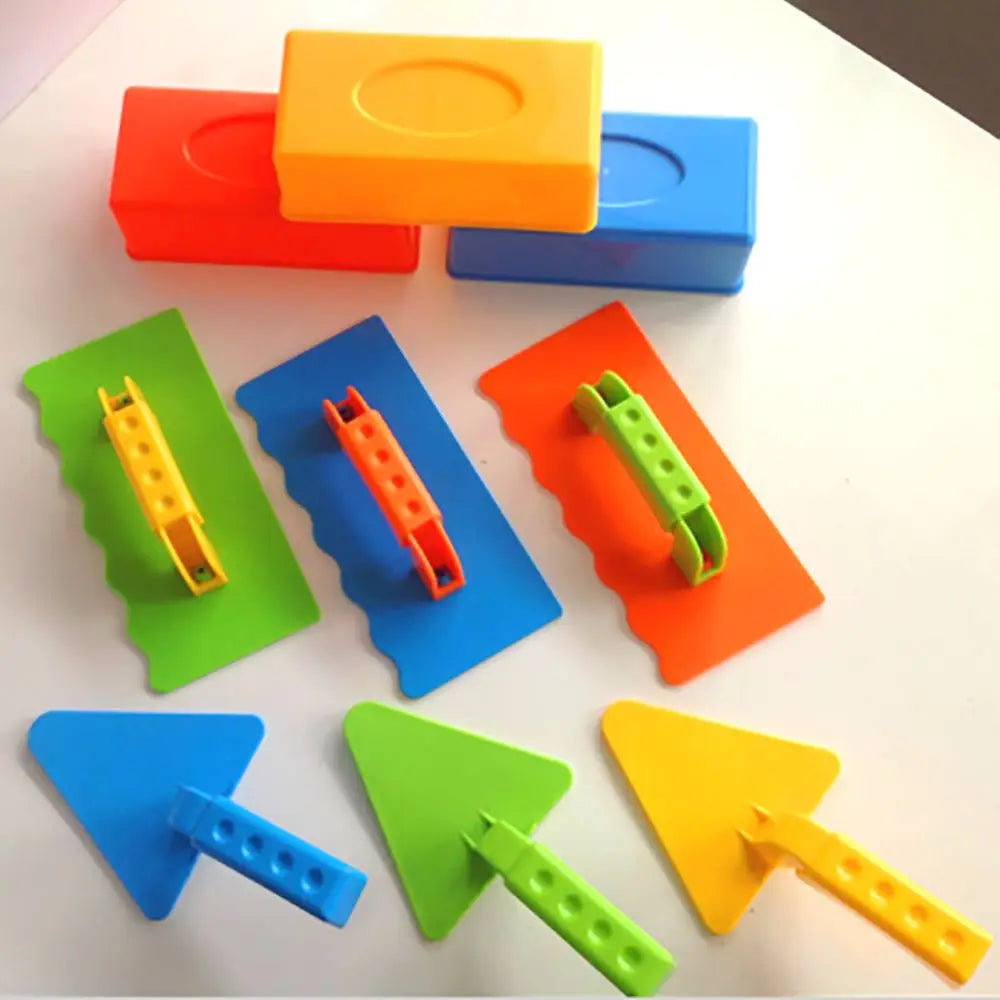 A set of colorful plastic molds for making sand and snow bricks, including rectangular and triangular shapes.
