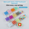 Nine-grid stress relief keyboard keychain featuring colorful LED keycaps and a red fidget cube.