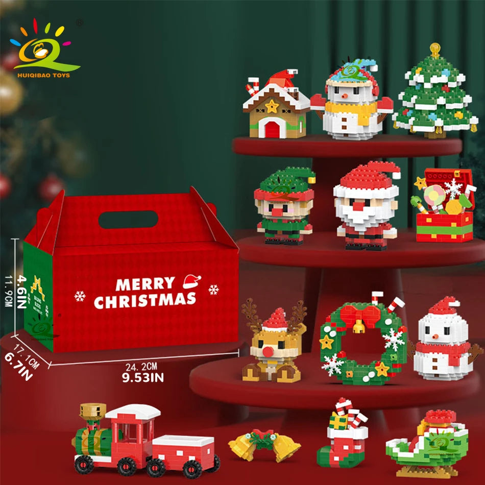 Un set de figurines de construction mini de Noël et une boîte cadeau rouge exposés sur une étagère en bois.