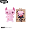 A pink Fuggler Tooth Monsters plush toy with large eyes and a wide mouth.