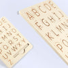 A wooden Montessori letter tracing board showing the alphabet from A to Z in a light wood tone.