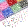 A collection of colorful glass beads in various shades including pink, red, green, and blue, displayed in a clear plastic con