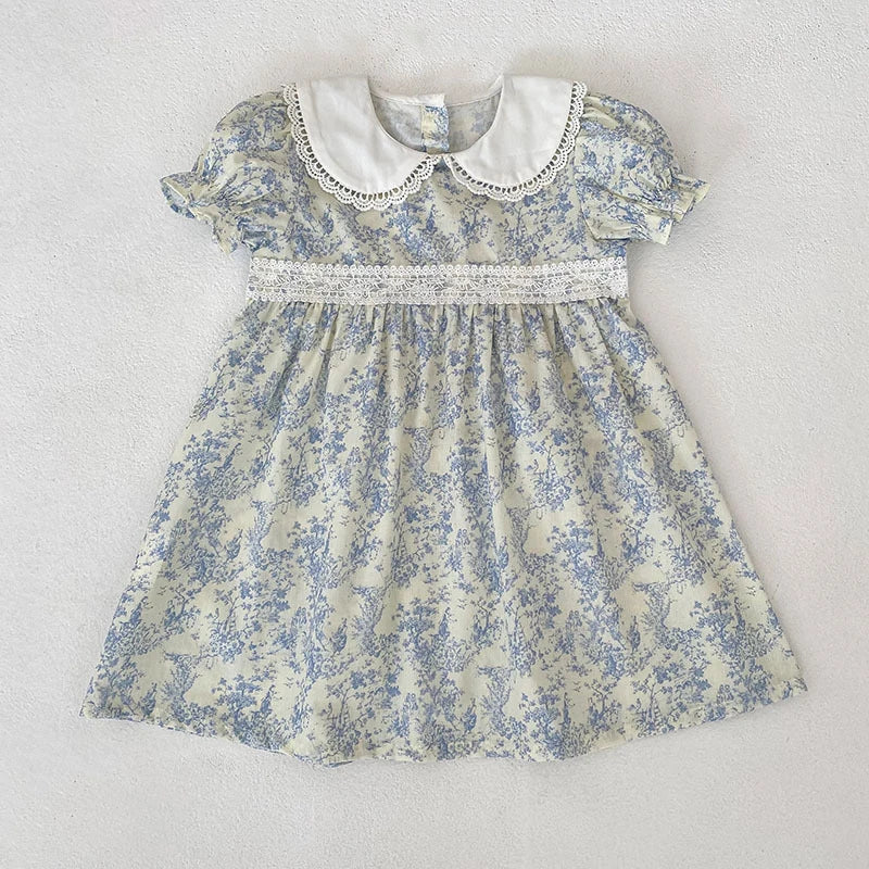 A light blue floral dress for girls featuring a Peter Pan collar and bubble sleeves.