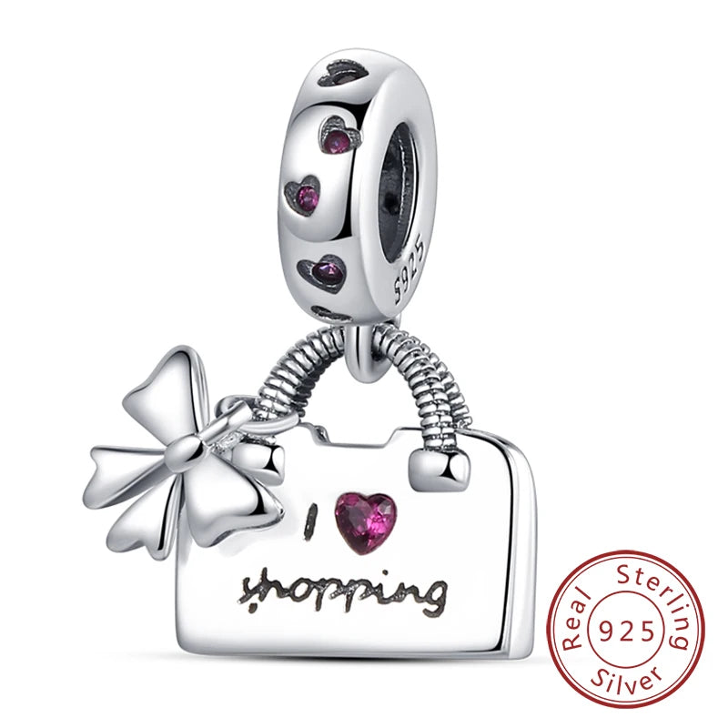 Sterling silver heart charm beads for bracelets featuring a floral pendant and a heart charm.