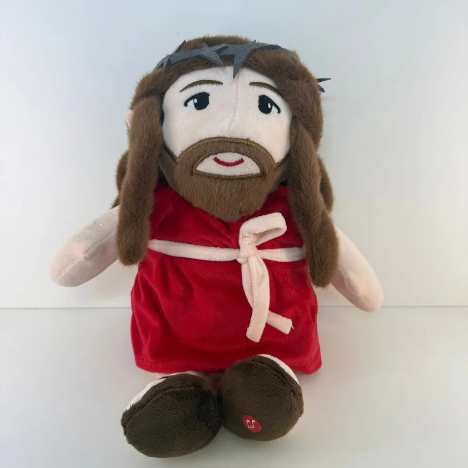 A plush doll depicting Jesus with long brown hair and a beard wearing a red garment.