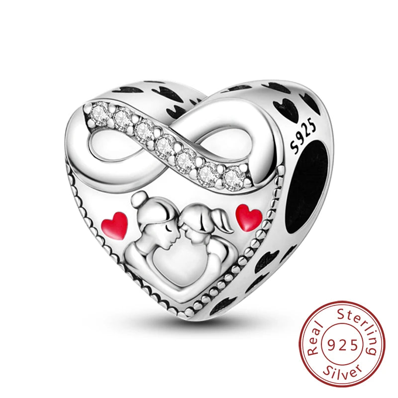 A sterling silver heart charm bead featuring an infinity design and a couple silhouette, set against a black background.