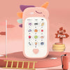 A pink baby phone toy with colorful ears and a keypad is shown on a wooden surface.