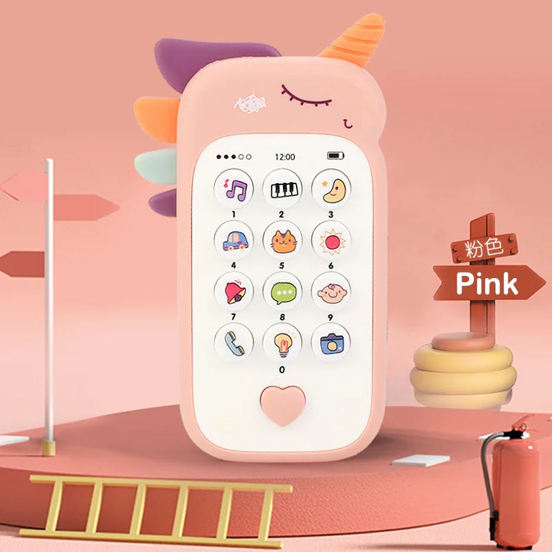 A pink baby phone toy with colorful ears and a keypad is shown on a wooden surface.