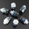 A set of seven floral resin potion bottle polyhedral dice, featuring numbers 0 through 10 and a six-sided die.