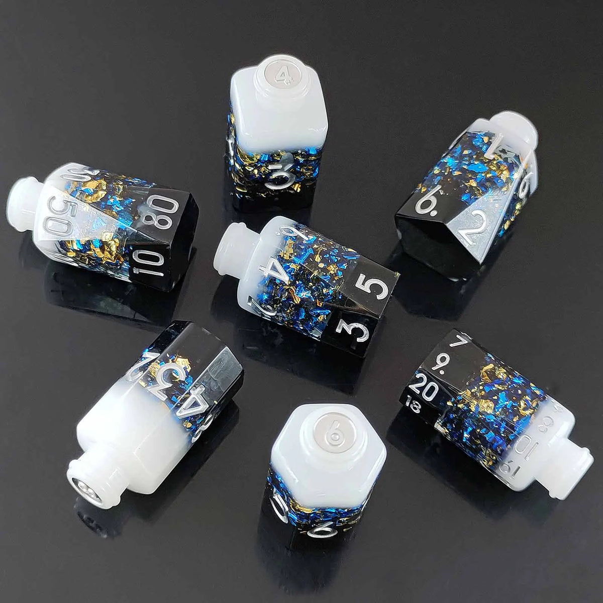A set of seven floral resin potion bottle polyhedral dice, featuring numbers 0 through 10 and a six-sided die.