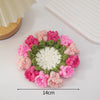Hand-crocheted floral coasters featuring pink and green yarn in a circular arrangement.