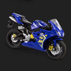 A blue 1:18 scale KTM 450 SX-F diecast motorcycle model shown in a studio setting.