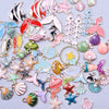 Assortment of gold-tone enamel charms featuring various shapes and colors for jewelry making