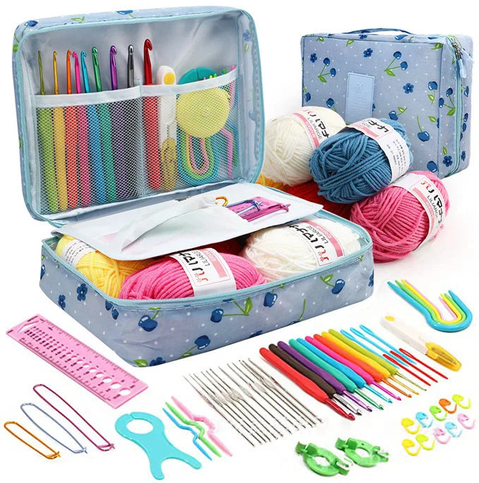 A set of 59 crochet needles and yarn with a blue organizer case and various tools.