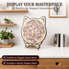 A wooden cat-shaped jigsaw puzzle for adults displayed on a white shelf.