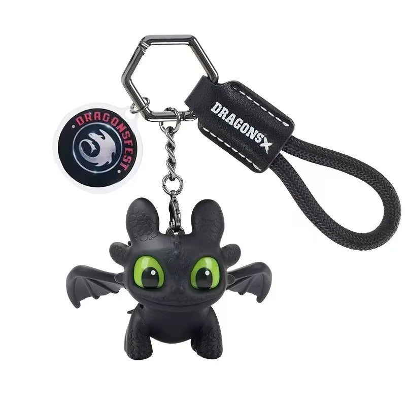 A black Toothless Dragon keychain featuring movable wings and glowing eyes.