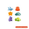 Seis animales de plástico suave, incluyendo un pez azul, una rana naranja, una tortuga azul, un pájaro amarillo, una criatura
