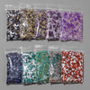 A collection of various colored natural tumbled stone chips packaged in clear plastic bags.