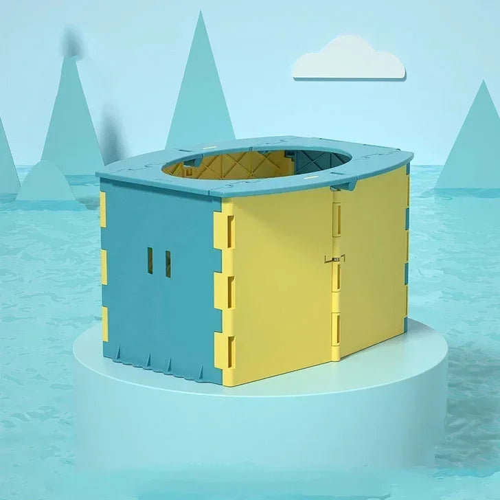 A foldable baby potty training seat in blue and yellow is shown floating on water with stylized mountains in the background.