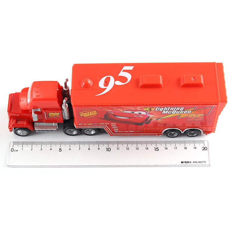 A red Lightning McQueen die-cast toy hauler truck with the number 95 on the side.