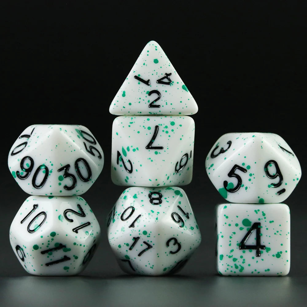A set of white acrylic dice showing numbers 1 through 9 arranged in a pyramid formation.