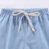 Light blue cotton-linen summer shorts with a beige drawstring waist