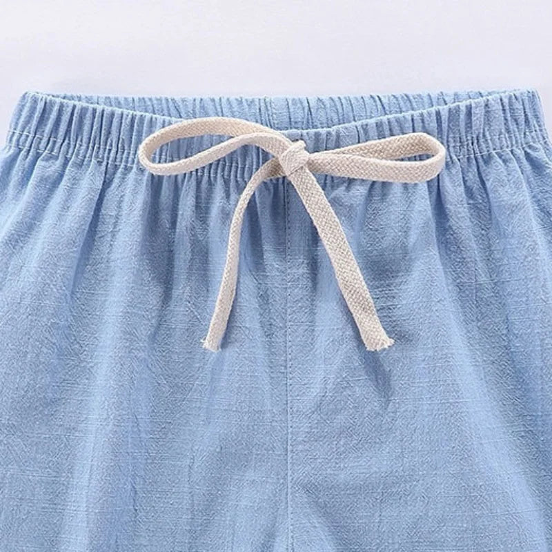 Light blue cotton-linen summer shorts with a beige drawstring waist
